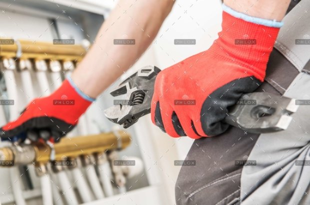 demo-attachment-137-op_technician-repairs-heating-JFGPBHA-scaled